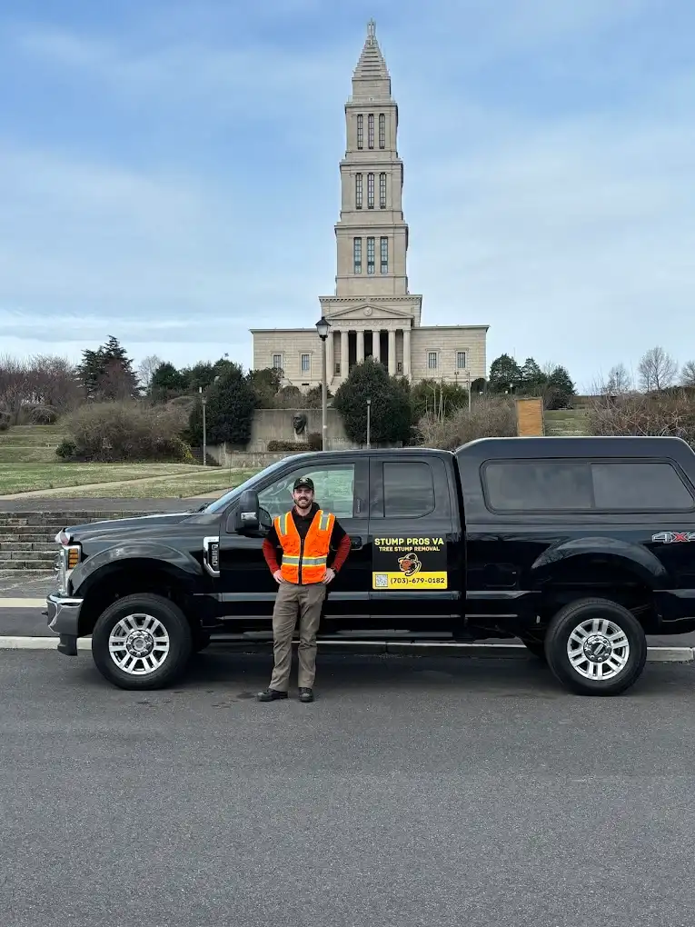 Stump Pros VA truck and crew member in front of George Washington Masonic Memorial in Alexandria, Virginia